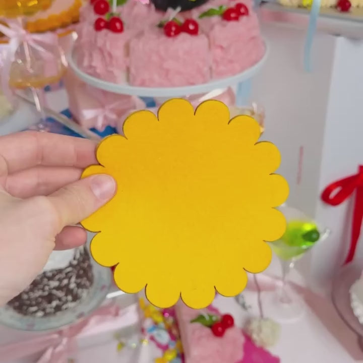 A video of someone handling a single felt cocktail napkin in their hand.